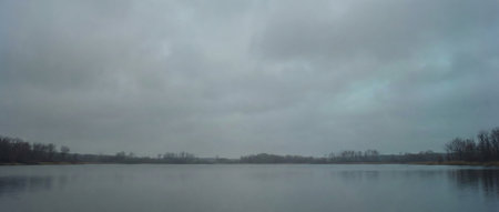 Panoramic view of the lake and forest on a cloudy dayの素材