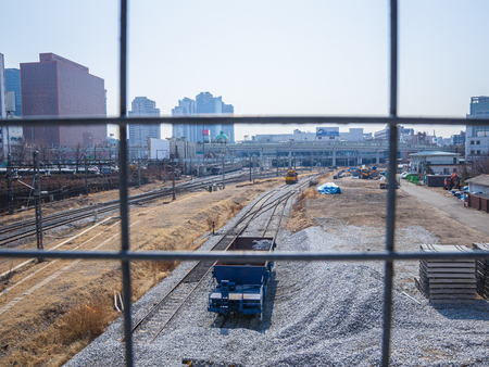 Seoul, South Korea - March 2018: photo taken from behind a grating, view of the station with rails and gravel. city ?? background.のeditorial素材