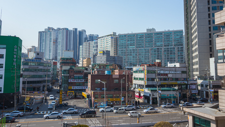 Seoul, South Korea - March 2018: typical area of the city where you can see buildings with signs and traffic on a beautiful day.のeditorial素材