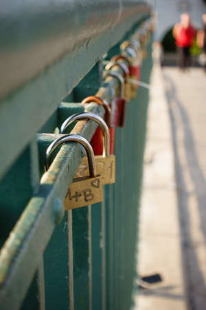 love padlock on a bridge over the riverの写真素材