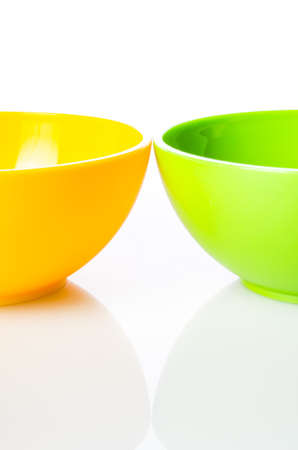 Colorful plastic snack bowls on white backgroundの写真素材