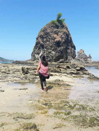 A girl dancing on the beatiful beachの素材