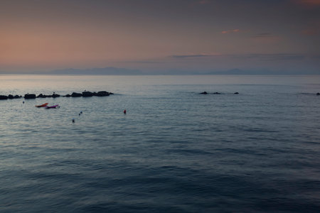 sunset on the sea with some orange clouds
