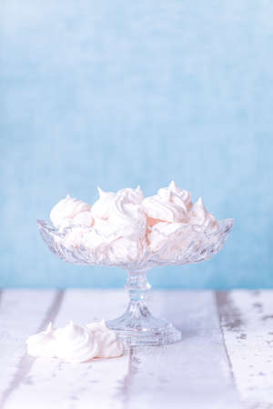 white tasty Meringe with blue backgroundの写真素材