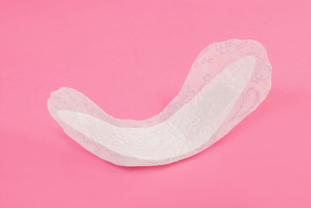 Woman daily pad hygiene protection isolated on pink background