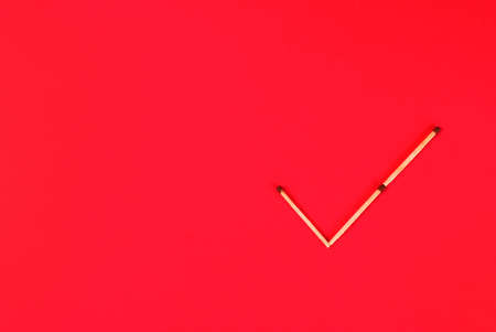 Sign ok make of matches on red backgroundの写真素材