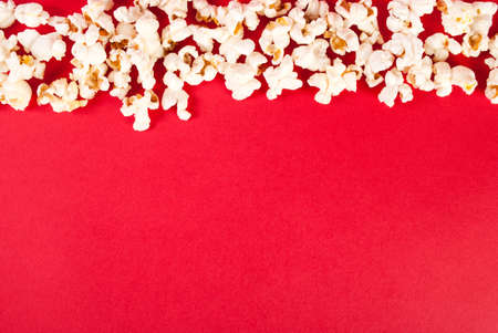 Popcorn on red background with free space, top viewの写真素材