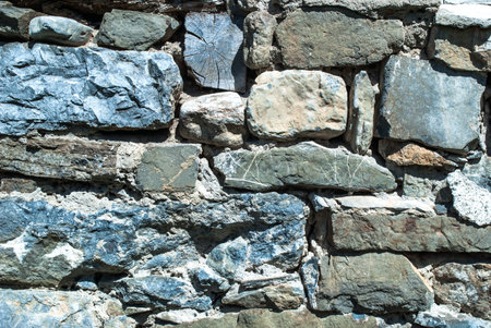 Texture of stone wall on daylight outside