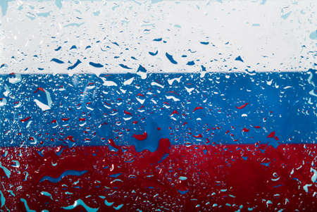 Drops of water on Russian flag background. Shallow depth of field. Selective focus. Tonedの写真素材