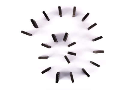 Spiral of domino tales isolated on white backgroundの写真素材