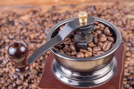 Close up of old retro coffee grinder with roasted coffee beans. Close up, selective focusの写真素材