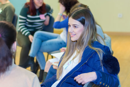 Nis, Serbia - February 13, 2019 Group of young university girls students having a group discussion...