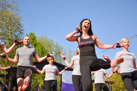 Nis, Serbia - April 20, 2019 Piloxing sport training group of people on sunny spring day outdoor with happy instructor on April 20, 2019 in park Sveti Sava, Nis, Serbia, Europeのeditorial素材