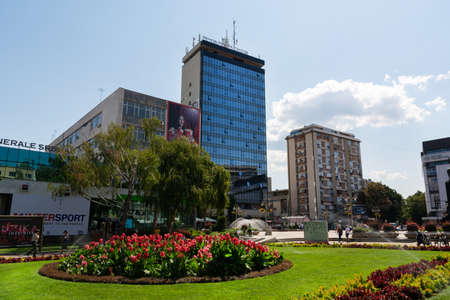 Nis, Serbia - August 28, 2019: Beautiful city park with fresh grass and flowers and building in city downtown on summer sunny clear day in the city of Nis, Serbiaのeditorial素材