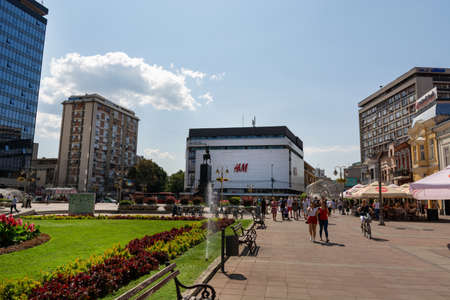 Nis, Serbia - August 28, 2019: Walking street and square with people and a city park with fresh grass and in city downtown on summer sunny day in the city of Nis, Serbiaのeditorial素材