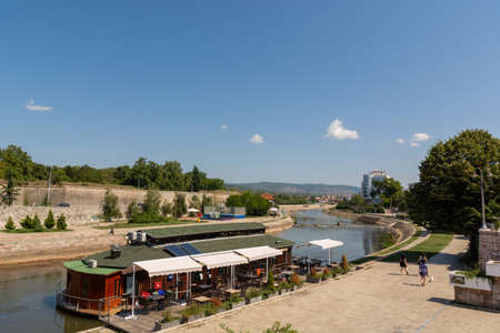 Nis, Serbia - August 28, 2019: Raft restaurant on river Nisava and a quay promenade on summer sunny day in the city of Nis, Serbiaのeditorial素材