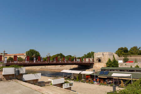 Nis, Serbia - August 28, 2019: Fortress with a bridge and Nisava river flows under the bridge and quay promenade on summer sunny day in the city of Nis, Serbiaのeditorial素材