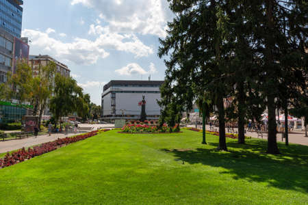 Nis, Serbia - August 28, 2019: Big public park with green lawn and flowers in city downtown with tree and a promenade on summer sunny day in the city of Nis, Serbiaのeditorial素材