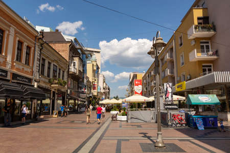 Nis, Serbia - August 28, 2019: Promenade street with cafes  and shops with walking people and buildings on summer sunny day in the city of Nis, Serbiaのeditorial素材