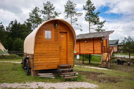Zlatibor, Vodice, Serbia - July 26. 2020 Wooden house with wheels or a wagon in the city of El Paso in wild west style and cowboy style. Western thematic park. Travel conceptのeditorial素材