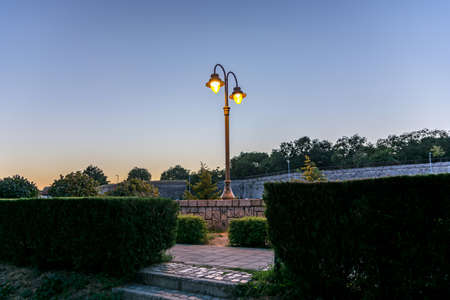 Nis, Serbia - September 07, 2021 A beautiful street lamp in retro style illuminates an autumn evening in a park in the city of Nisのeditorial素材