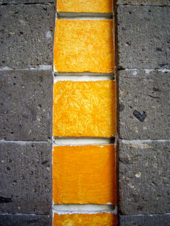 Detail of yellow and gray stone wallsの写真素材