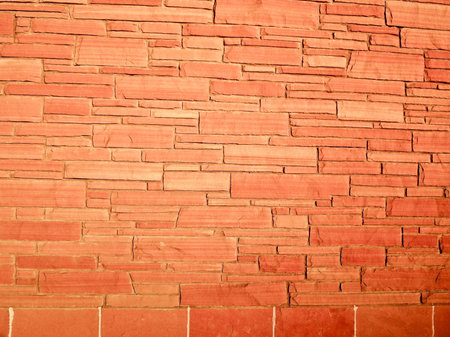 Modern stone wall of orange block