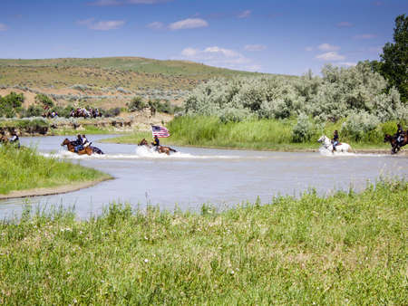 US Cavalry soldiers with flag cross riverのeditorial素材
