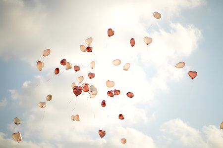 Heart shaped balloons flying in the sky, valentines day backgroundの素材
