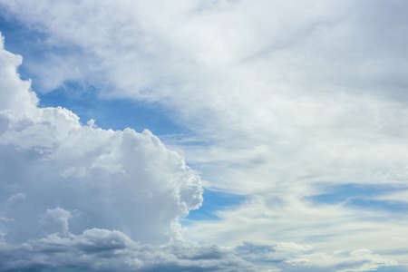 Blue sky background with white cloudsの写真素材
