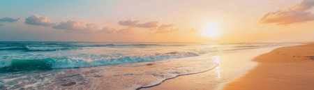 Serene sunset over a sandy beach with gentle waves.の素材