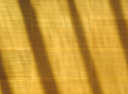 Orange absorber panels pattern with the water shading on the wall
