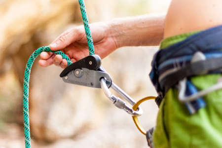 Climber belaying his partnerの写真素材