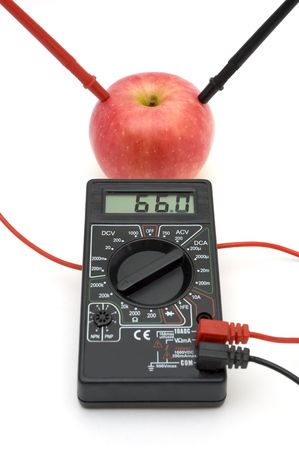 Measuring the energy of red apple, connected to gaugeの写真素材