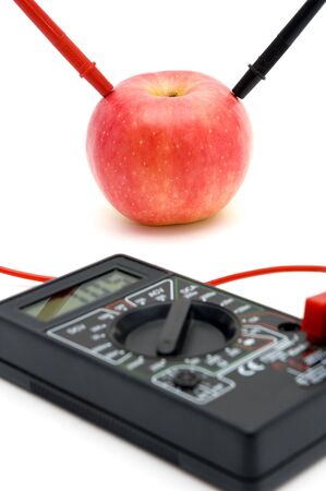 Measuring the energy of red apple, connected to gaugeの写真素材