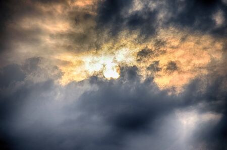 Sunset sky with clouds and sunの写真素材