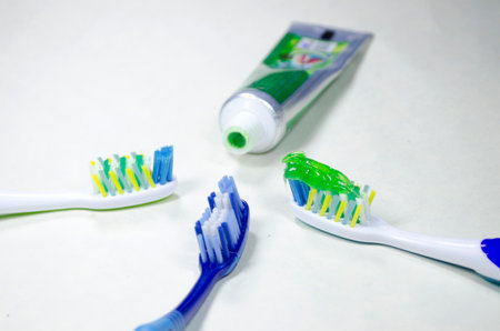 Toothbrushes and toothpaste on a white background close upの写真素材