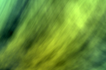 abstract background with green and yellow blurred spots in the center.の写真素材