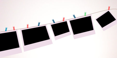 Photo frames with clothespins on a clothesline on a white background