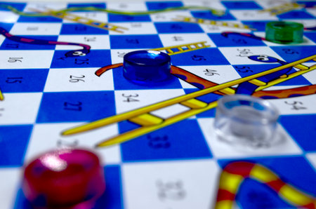 Close up of a checkerboard game with a blue and white checkerboardの写真素材