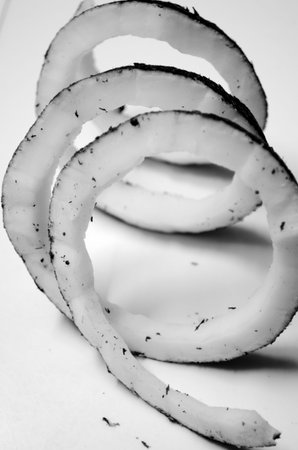 Sliced onion on a white background. Close-up.の写真素材