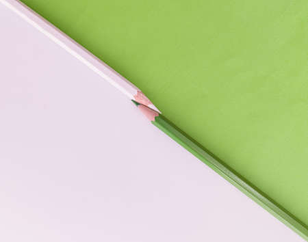 Colored pencils on a green background. Place for text.の写真素材