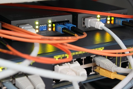 Optical and ethernet connections plugged.の写真素材