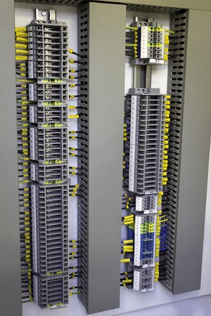Industrial electrical cubicle with terminals mounted on a DIN rail.の写真素材