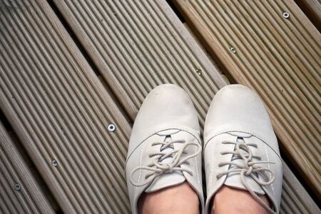 leather shoes on wooden planksの写真素材