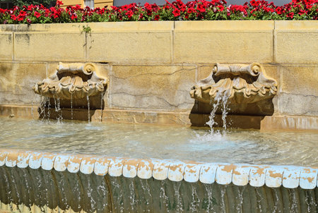 Fountains on the wall of the buildingの写真素材