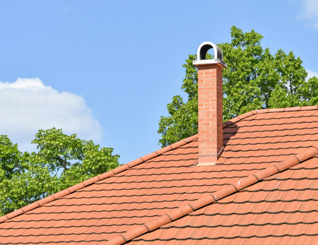 House roof with smoke stack