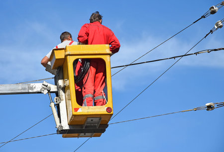 Electricians are working in heightの写真素材