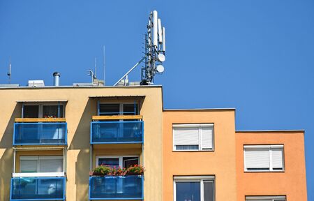 Antennas on the top of an apartment buildingの写真素材