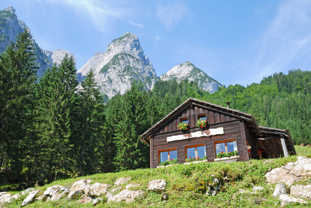 Wooden building and mountains at Gosau, Austriaの写真素材